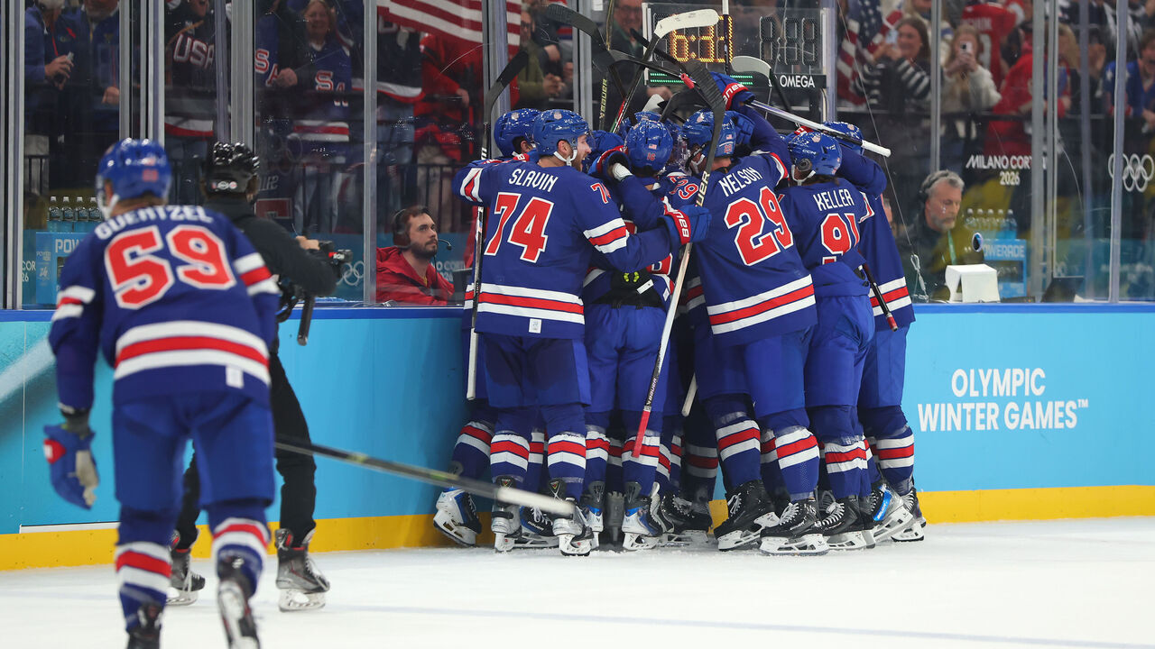 MILAN, ITALY - FEBRUARY 18: Quinn Hughes #43 of Team United States celebrates with teammates after scoring a goal in overtime during the Men's Quarterfinals Playoff match between the United States and Sweden on day 12 of the Milano Cortina 2026 Winter Olympic games at Milano Santagiulia Ice Hockey Arena on February 18, 2026 in Milan, Italy.