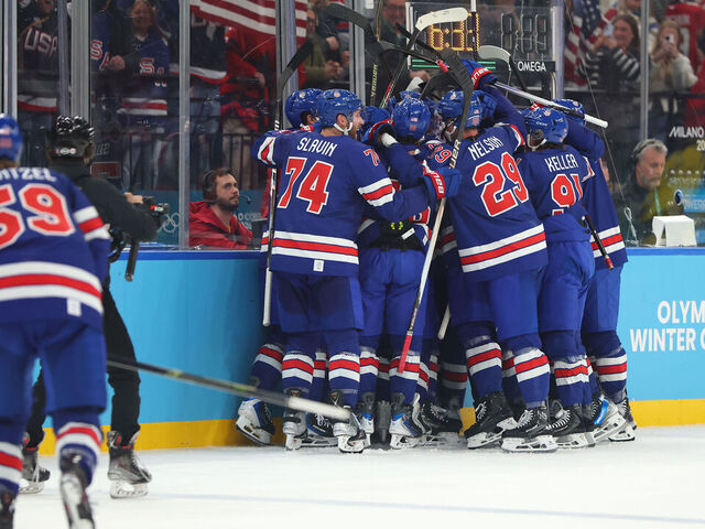MILAN, ITALY - FEBRUARY 18: Quinn Hughes #43 of Team United States celebrates with teammates after scoring a goal in overtime during the Men's Quarterfinals Playoff match between the United States and Sweden on day 12 of the Milano Cortina 2026 Winter Olympic games at Milano Santagiulia Ice Hockey Arena on February 18, 2026 in Milan, Italy.