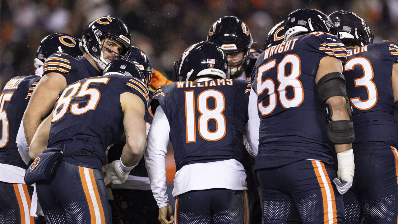 CHICAGO, ILLINOIS - JANUARY 18: Caleb Williams #18 of the Chicago Bears leads a huddle during an NFL divisional playoff football game against the Los Angeles Rams at Soldier Field on January 18, 2026 in Chicago, Illinois.