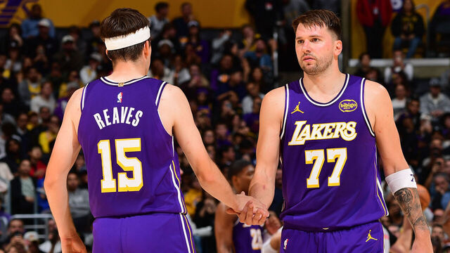 LOS ANGELES, CA - NOVEMBER 28: Austin Reaves #15 and Luka Doncic #77 of the Los Angeles Lakers high five during the game against the Dallas Mavericks during a 2025-26 Emirates NBA Cup on November 28, 2025 at Crypto.Com Arena in Los Angeles, California. NOTE TO USER: User expressly acknowledges and agrees that, by downloading and/or using this Photograph, user is consenting to the terms and conditions of the Getty Images License Agreement. Mandatory Copyright Notice: Copyright 2025 NBAE
