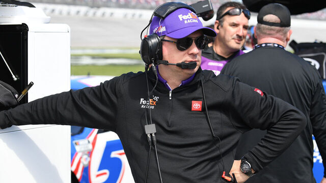 TALLADEGA, AL - APRIL 22: Chris Gabehart, crew chief for Denny Hamlin (#11 Joe Gibbs Racing FedEx Freight Direct Toyota) looks on during qualifying for the NASCAR Cup Series Geico 500 on April 22, 2023, at Talladega Superspeedway in Talladega, AL.