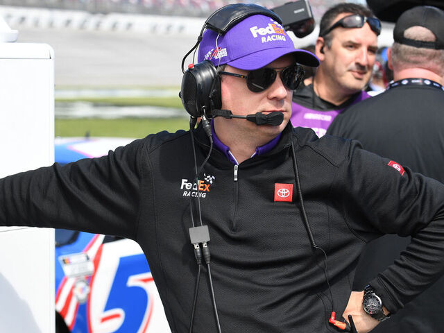 TALLADEGA, AL - APRIL 22: Chris Gabehart, crew chief for Denny Hamlin (#11 Joe Gibbs Racing FedEx Freight Direct Toyota) looks on during qualifying for the NASCAR Cup Series Geico 500 on April 22, 2023, at Talladega Superspeedway in Talladega, AL.