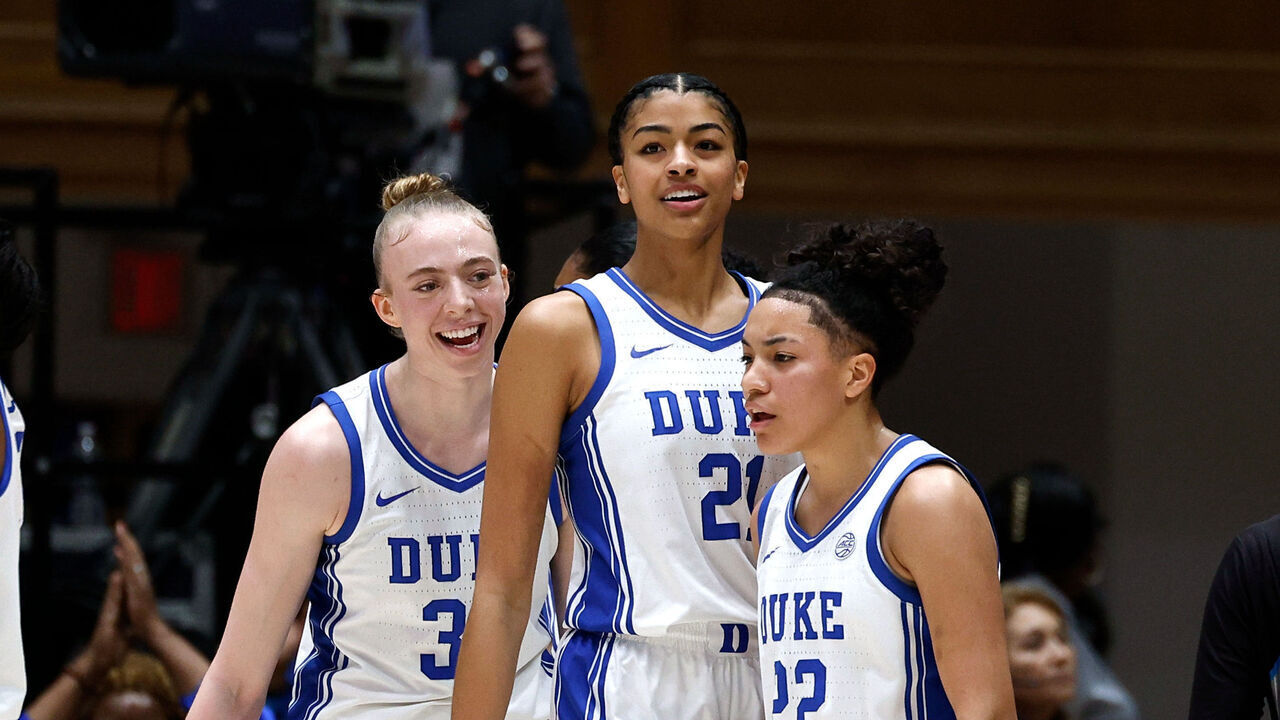 DURHAM, NORTH CAROLINA - FEBRUARY 19: Taina Mair #22 of the Duke Blue Devils reacts alongside teammates Toby Fournier #35 and Arianna Roberson #21 after a basket in the first half against the NC State Wolfpack at Cameron Indoor Stadium on February 19, 2026 in Durham, North Carolina.