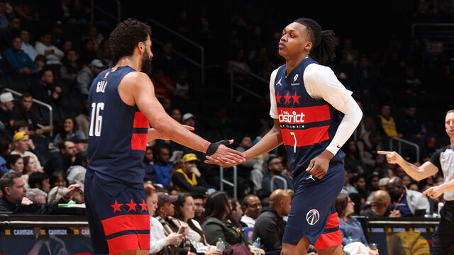 WASHINGTON, DC - FEBRUARY 19: Anthony Gill #16 and Bub Carrington #7 of the Washington Wizards high five during the game against the Indiana Pacers on February 19, 2026 at Capital One Arena in Washington, DC. Mandatory Copyright Notice: Copyright 2026 NBAE