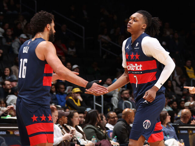WASHINGTON, DC - FEBRUARY 19: Anthony Gill #16 and Bub Carrington #7 of the Washington Wizards high five during the game against the Indiana Pacers on February 19, 2026 at Capital One Arena in Washington, DC. Mandatory Copyright Notice: Copyright 2026 NBAE