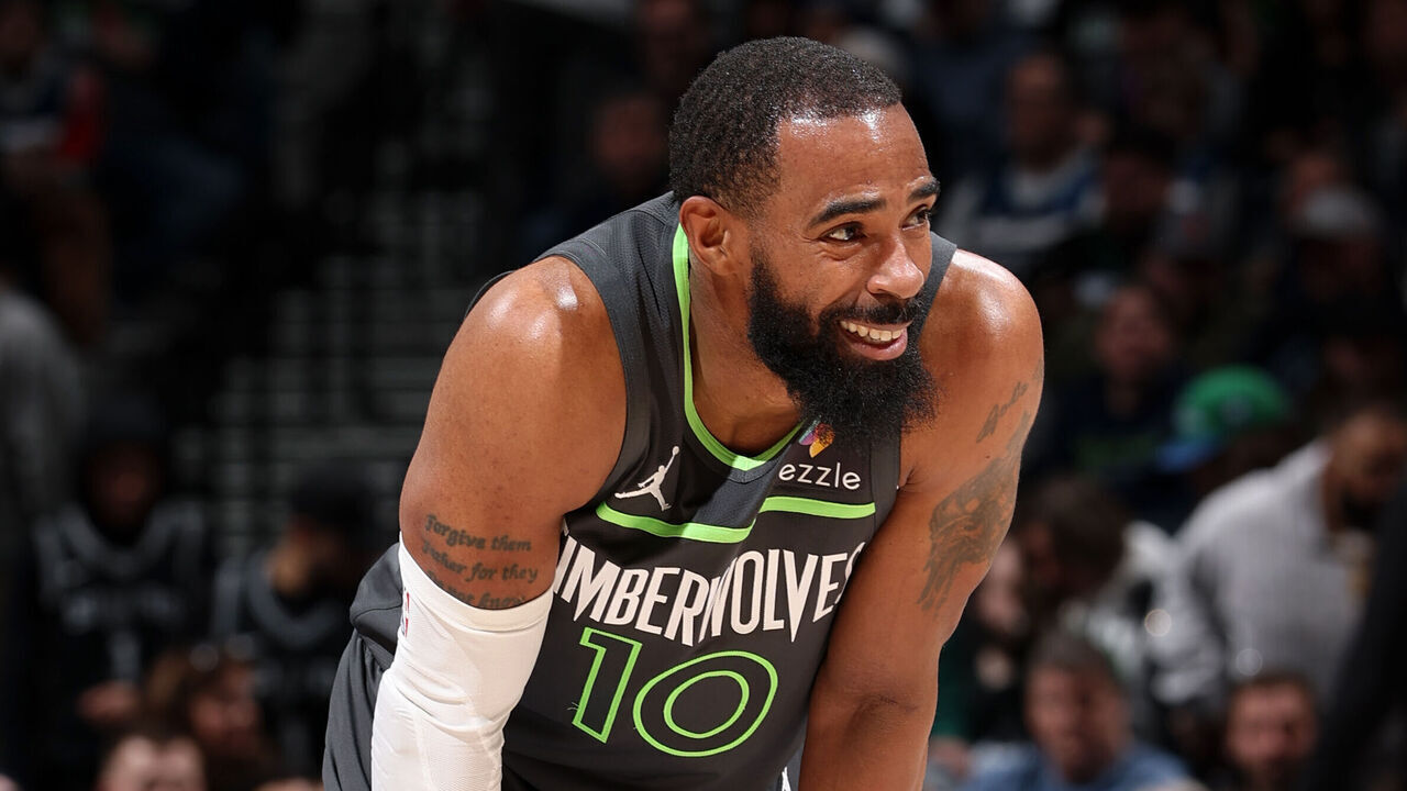 MINNEAPOLIS, MN - JANUARY 11: Mike Conley #10 of the Minnesota Timberwolves smiles during the game against the San Antonio Spurs on January 11, 2026 at Target Center in Minneapolis, Minnesota. Mandatory Copyright Notice: Copyright 2026 NBAE