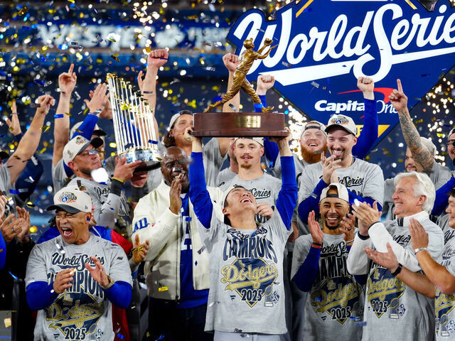 TORONTO, ON - NOVEMBER 01: Yoshinobu Yamamoto #18 of the Los Angeles Dodgers hoists the 2025 Willie Mays World Series Most Valuable Player trophy after the Dodgers defeated the Toronto Blue Jays in Game Seven of the 2025 World Series presented by Capital One between the Los Angeles Dodgers and the Toronto Blue Jays at Rogers Centre on Saturday, November 1, 2025 in Toronto, Ontario, Canada.