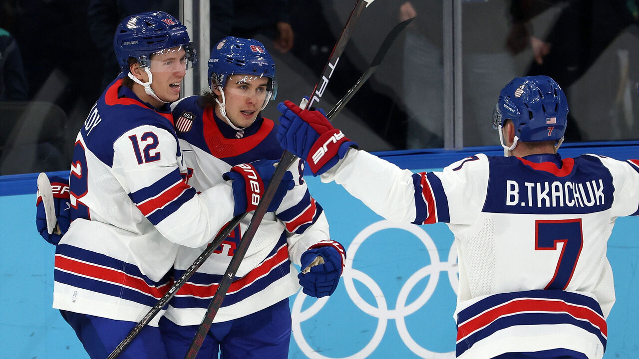 MILAN, ITALY - FEBRUARY 20: Jack Hughes #86 of Team United States celebrates after scoring a goal with Matt Boldy #12 and Brady Tkachuk #7 of Team United States in the second period during the Men's Semifinals Playoff match between the United States and Slovakia on day fourteen of the Milano Cortina 2026 Winter Olympic games at Milano Santagiulia Ice Hockey Arena on February 20, 2026 in Milan, Italy.