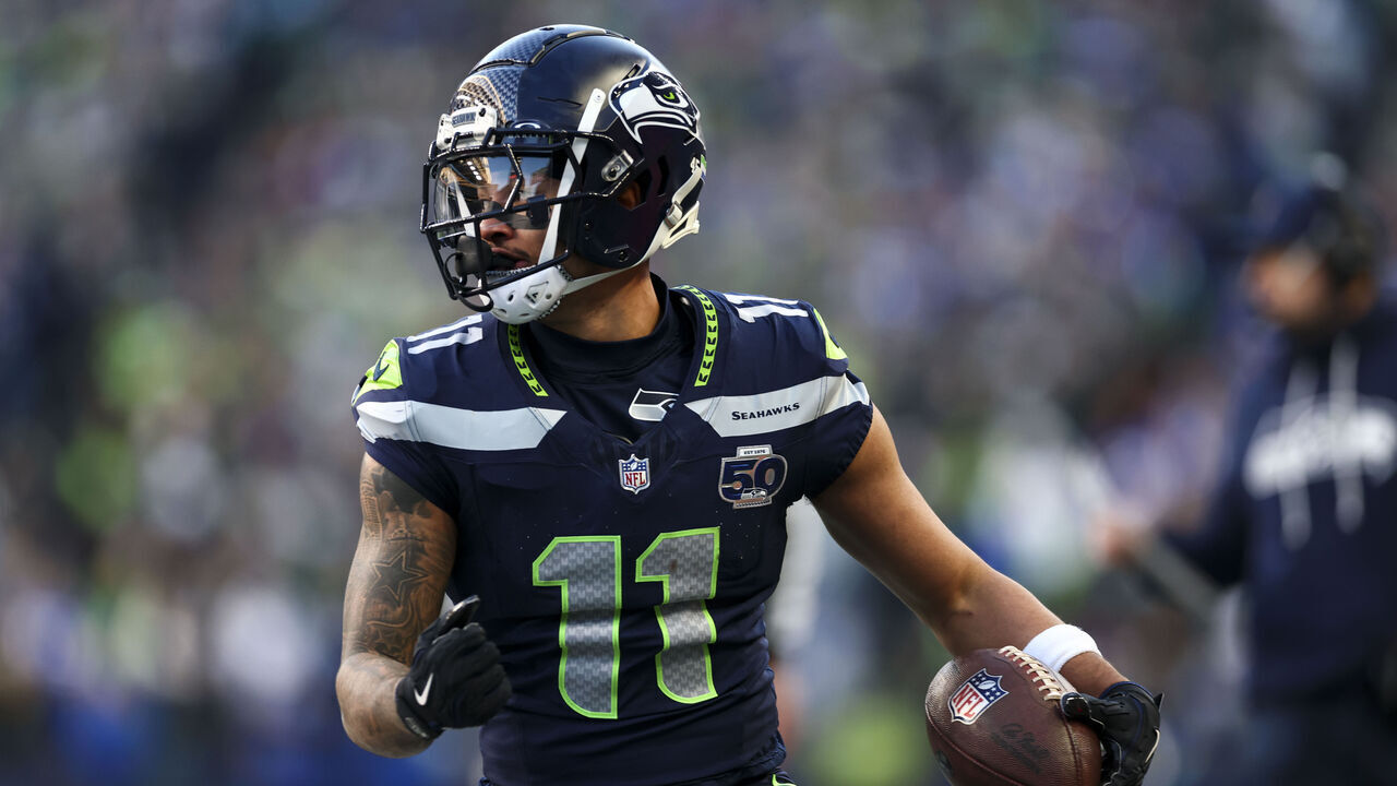 SEATTLE, WASHINGTON - JANUARY 25: Jaxon Smith-Njigba #11 of the Seattle Seahawks carries the ball after making a catch during the first quarter of the NFC Championship NFL football game against the Los Angeles Rams, at Lumen Field on January 25, 2026 in Seattle, WA.