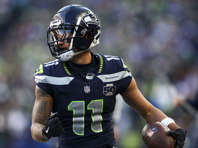SEATTLE, WASHINGTON - JANUARY 25: Jaxon Smith-Njigba #11 of the Seattle Seahawks carries the ball after making a catch during the first quarter of the NFC Championship NFL football game against the Los Angeles Rams, at Lumen Field on January 25, 2026 in Seattle, WA.