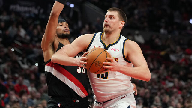 PORTLAND, OREGON - FEBRUARY 20: Nikola Jokic #15 of the Denver Nuggets drives to the basket against Toumani Camara #33 of the Portland Trail Blazers during the second half at Moda Center on February 20, 2026 in Portland, Oregon.