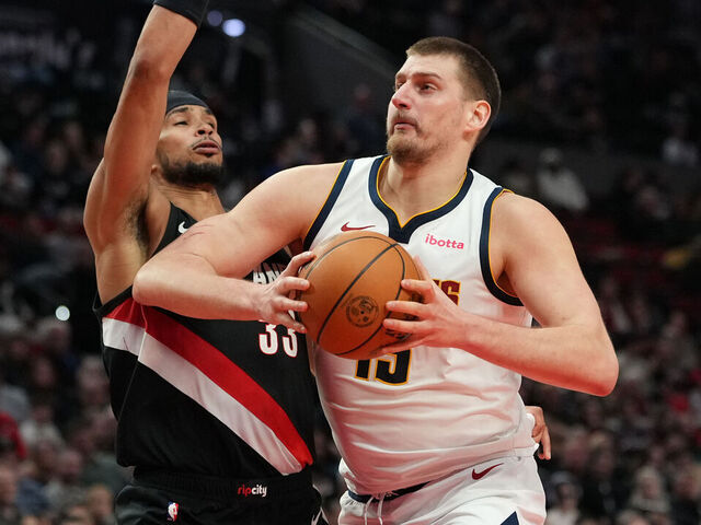 PORTLAND, OREGON - FEBRUARY 20: Nikola Jokic #15 of the Denver Nuggets drives to the basket against Toumani Camara #33 of the Portland Trail Blazers during the second half at Moda Center on February 20, 2026 in Portland, Oregon.