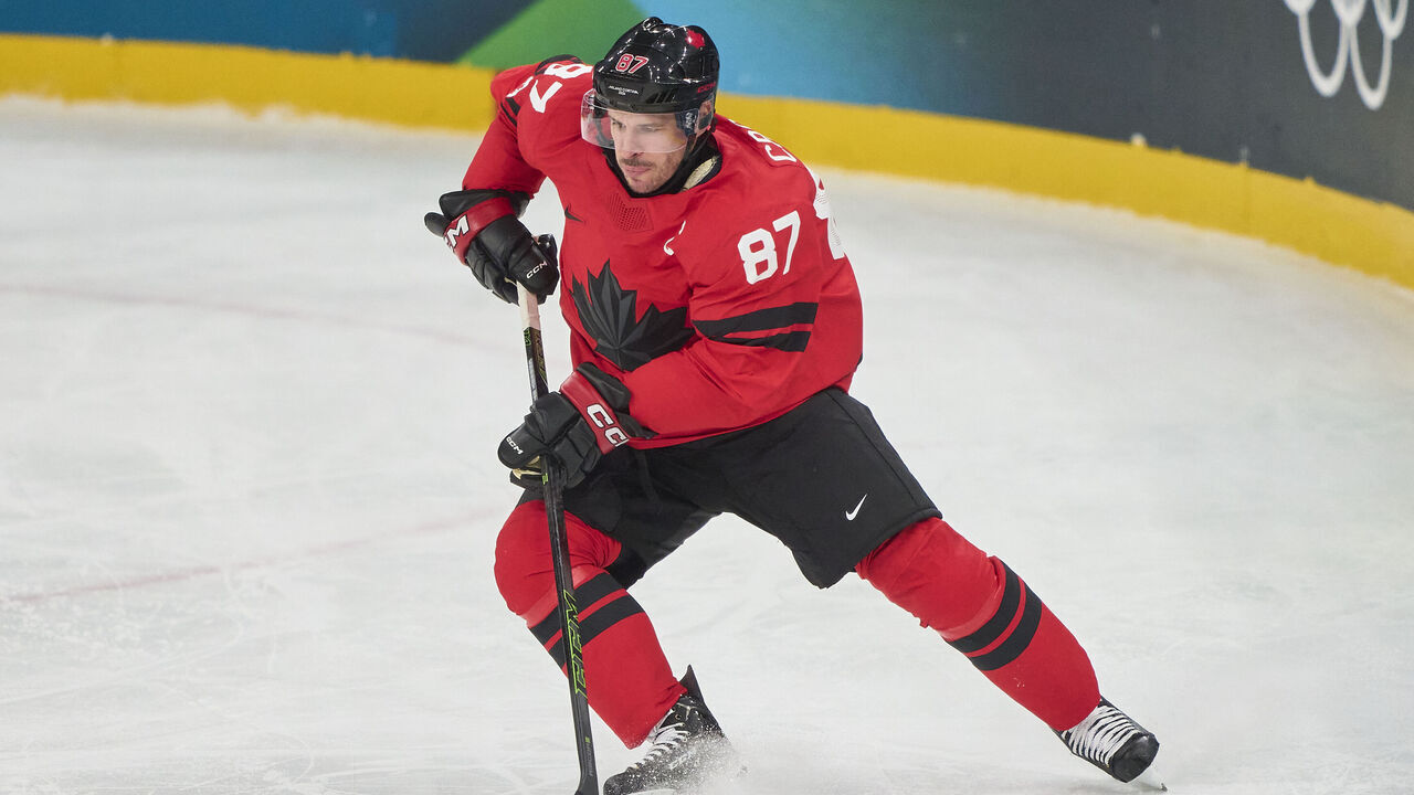 MILAN, ITALY - FEBRUARY 15: Sidney Crosby of Canada controls the puck during the Men's Preliminary Round Group A match between Canada and France on day nine of the Milano Cortina 2026 Winter Olympic games at Milano Santagiulia Ice Hockey Arena on February 15, 2026 in Milan, Italy.
