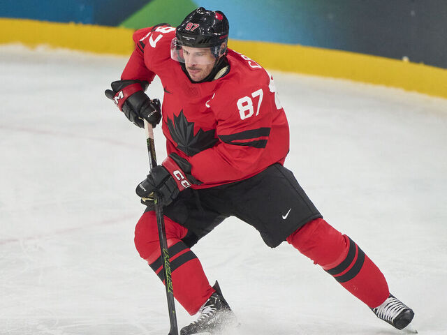 MILAN, ITALY - FEBRUARY 15: Sidney Crosby of Canada controls the puck during the Men's Preliminary Round Group A match between Canada and France on day nine of the Milano Cortina 2026 Winter Olympic games at Milano Santagiulia Ice Hockey Arena on February 15, 2026 in Milan, Italy.
