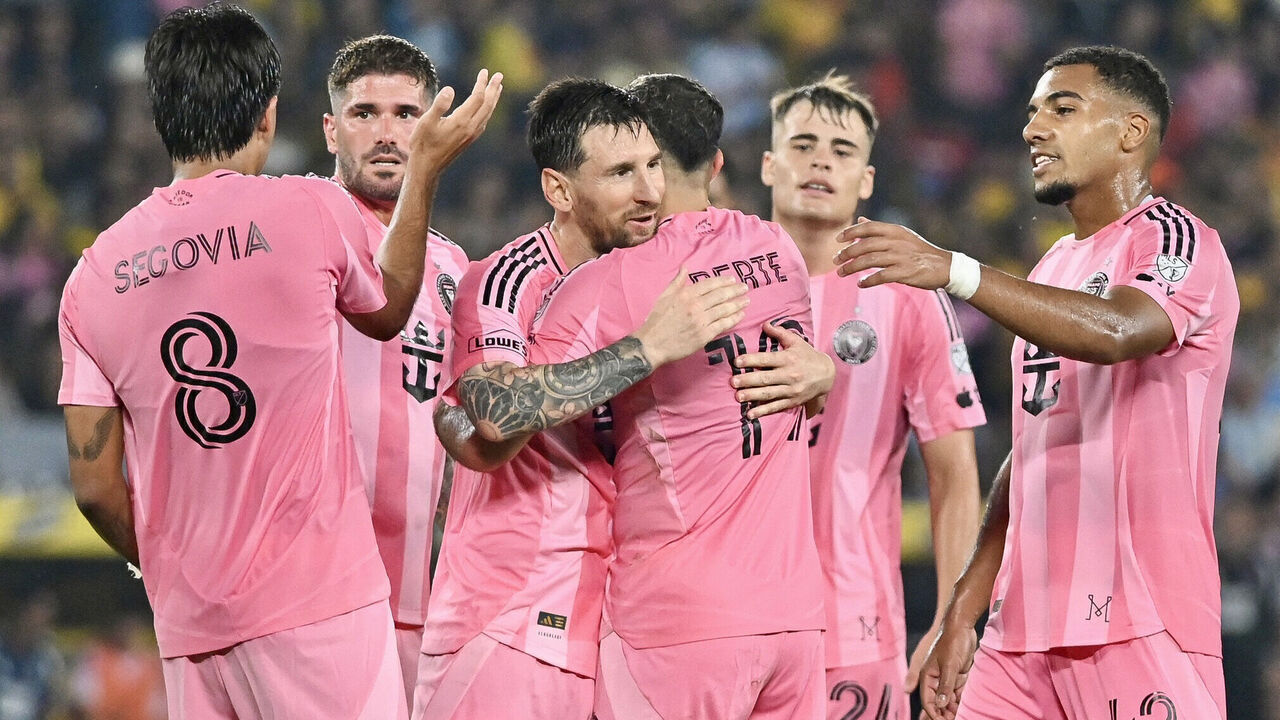 TOPSHOT - Inter Miami's Argentine forward #10 Lionel Messi (C-L) celebrates scoring his team's first goal during the friendly football match between Ecuador's Barcelona and the US' Inter Miami at the Banco Pichincha Stadium in Guayaquil, Ecuador, on February 7, 2026.