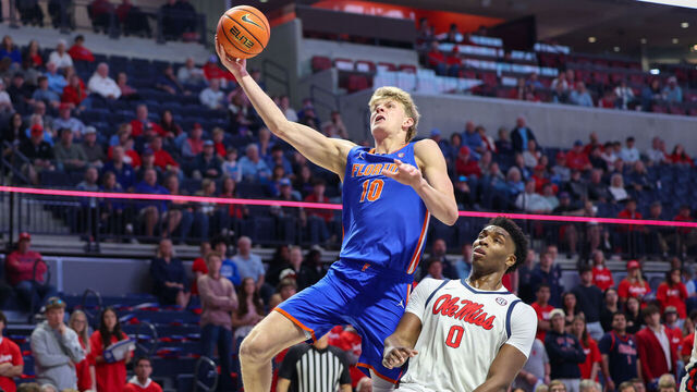 OXFORD, MISSISSIPPI - FEBRUARY 21: Thomas Haugh #10 of the Florida Gators shoots the ball against Malik Dia #0 of the Ole Miss Rebels during the first half at The Pavilion at Ole Miss on February 21, 2026 in Oxford, Mississippi.