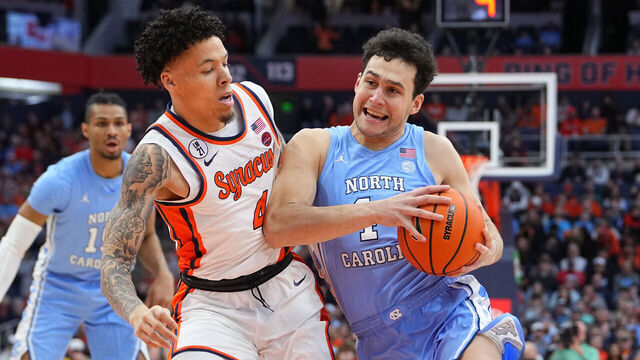 SYRACUSE, NY - FEBRUARY 21: North Carolina Tar Heels Guard luka Bogavac (44) drives the ball against Syracuse Orange Guard Nate Kingz (4) during the first half of the College Basketball game between the North Carolina Tar Heels and the Syracuse Orange on February 21, 2026, at the JMA Wireless Dome in Syracuse, NY.