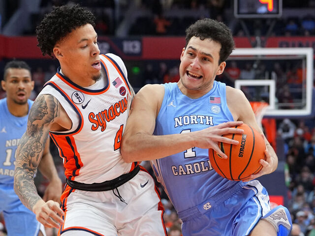 SYRACUSE, NY - FEBRUARY 21: North Carolina Tar Heels Guard luka Bogavac (44) drives the ball against Syracuse Orange Guard Nate Kingz (4) during the first half of the College Basketball game between the North Carolina Tar Heels and the Syracuse Orange on February 21, 2026, at the JMA Wireless Dome in Syracuse, NY.