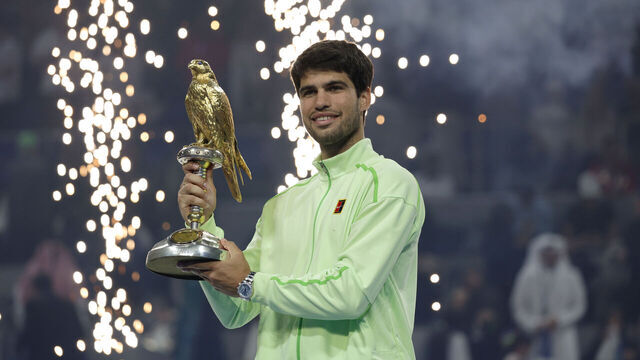 DOHA, QATAR - FEBRUARY 21: Carlos Alcaraz of Spain celebrates with the trophy after winning his men's singles final match against Arthur Fils of France at the Qatar ExxonMobil Open at Khalifa International Tennis and Squash Complex on February 21, 2026 in Doha, Qatar.