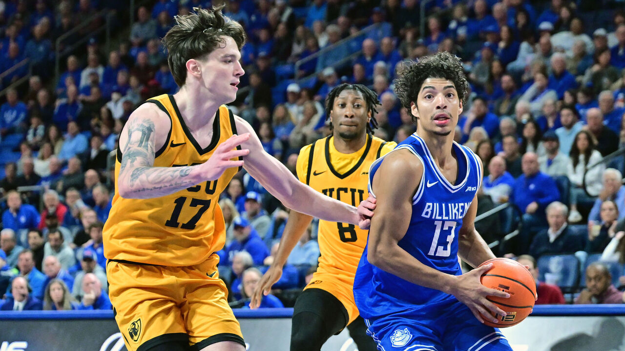 ST. LOUIS, MO - FEBRUARY 20: Saint Louis guard Dion Brown (13) drives to the basket as VCU Rams forward Lazar Djokovic (17) defends during an Atlantic 10 Conference basketball game between the Virginia Commonwealth Rams and the Saint Louis Billikens, on Feb. 20, 2026, at Chaifetz Arena in St. Louis, MO.