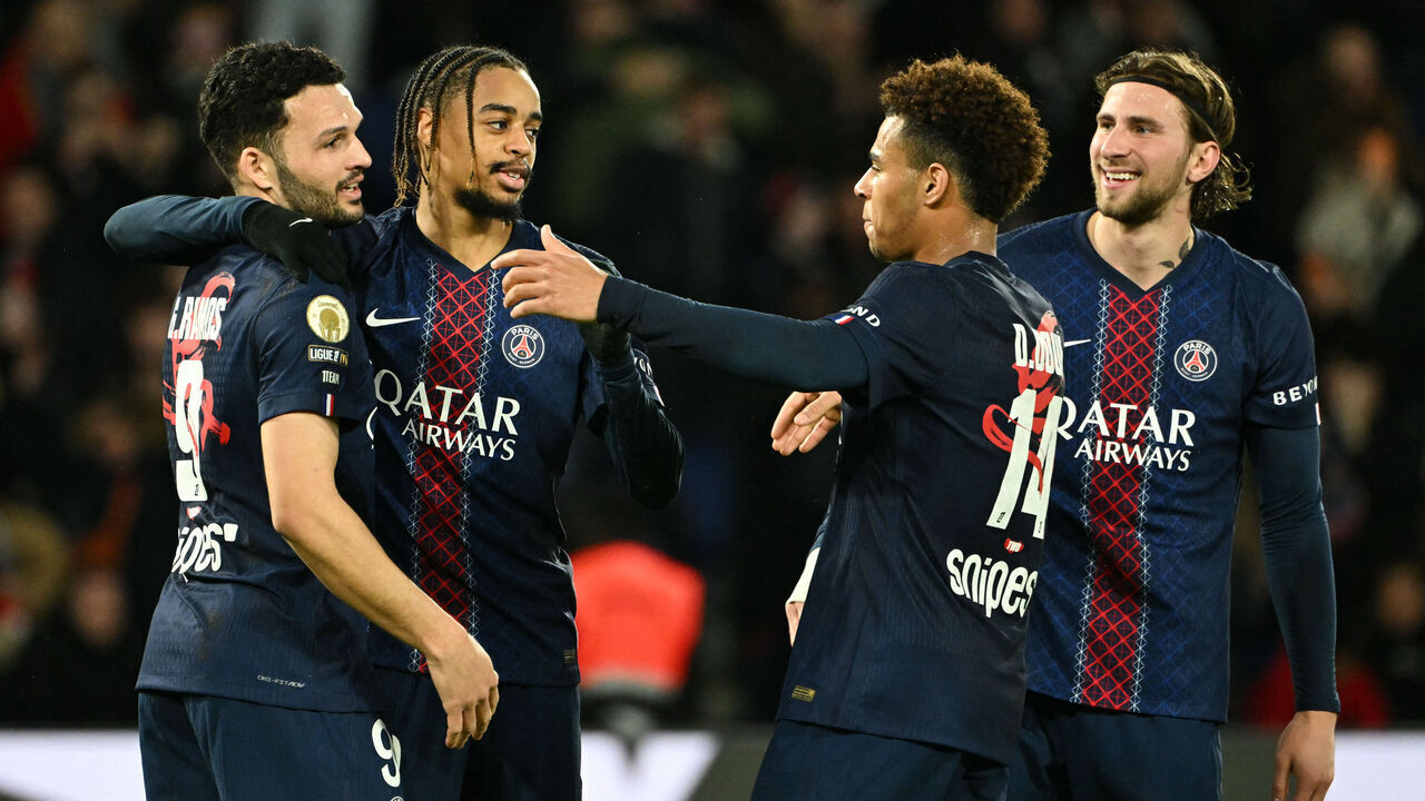 Paris Saint-Germain's French forward #29 Bradley Barcola (C-L) celebrates after scoring his team's second goal with Paris Saint-Germain's Portuguese forward #09 Goncalo Ramos (L), Paris Saint-Germain's French midfielder #14 Desire Doue (C-R) and Paris Saint-Germain's Ukrainian defender #06 Illia Zabarnyi (R) during the French L1 football match between Paris Saint-Germain (PSG) and FC Metz at the Parc des Princes stadium in Paris on February 21, 2026.