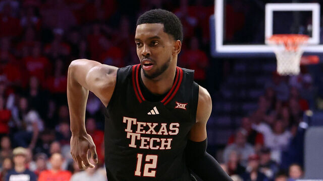 TUCSON, ARIZONA - FEBRUARY 14: Donovan Atwell #12 of the Texas Tech Red Raiders dribbles the ball during the second half against the Arizona Wildcats at McKale Center at ALKEME Arena on February 14, 2026 in Tucson, Arizona. The Red Raiders defeated the Wildcats 78-75 in overtime.