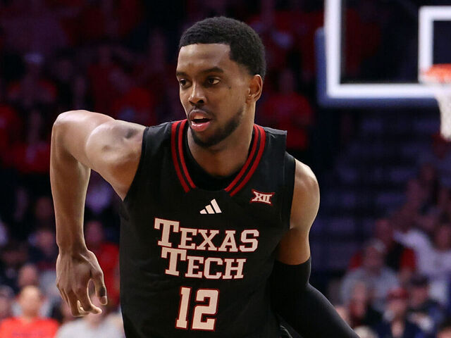 TUCSON, ARIZONA - FEBRUARY 14: Donovan Atwell #12 of the Texas Tech Red Raiders dribbles the ball during the second half against the Arizona Wildcats at McKale Center at ALKEME Arena on February 14, 2026 in Tucson, Arizona. The Red Raiders defeated the Wildcats 78-75 in overtime.