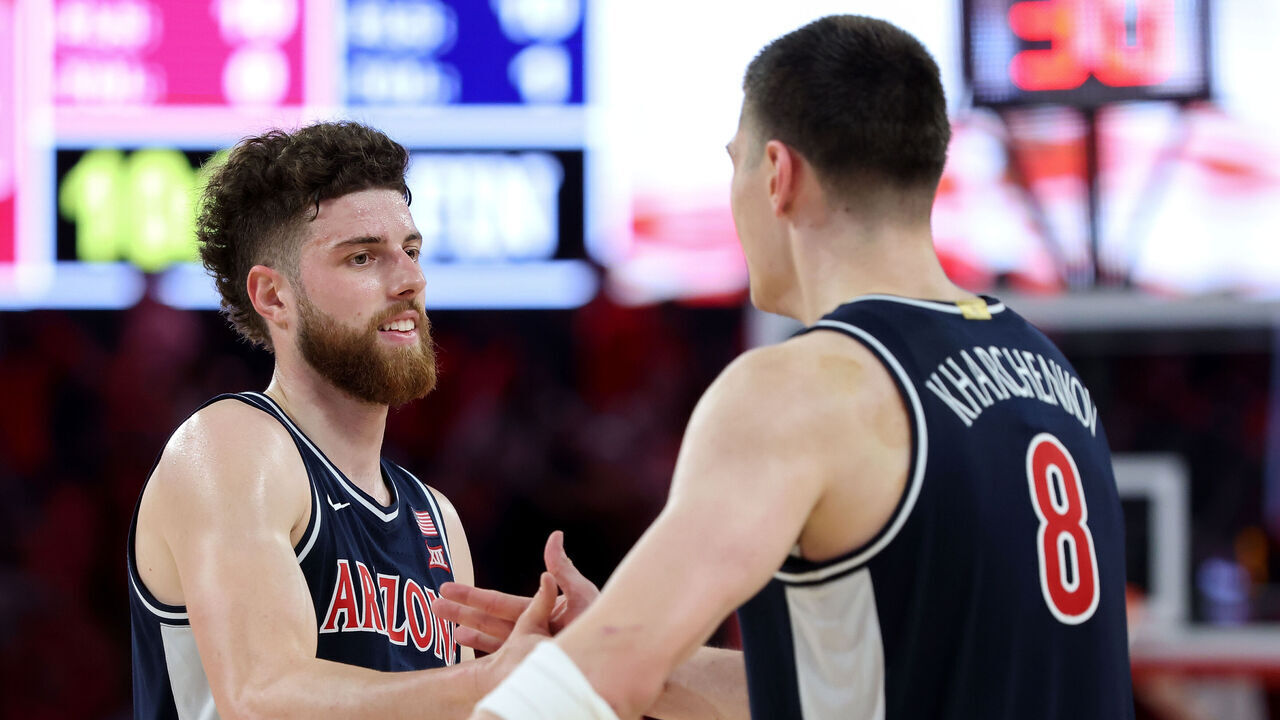 HOUSTON, TEXAS - FEBRUARY 21: Anthony Dell'orso #3 of the Arizona Wildcats congratulates Ivan Kharchenkov #8 after defeating the Houston Cougars at Fertitta Center on February 21, 2026 in Houston, Texas.