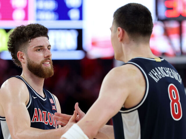 HOUSTON, TEXAS - FEBRUARY 21: Anthony Dell'orso #3 of the Arizona Wildcats congratulates Ivan Kharchenkov #8 after defeating the Houston Cougars at Fertitta Center on February 21, 2026 in Houston, Texas.