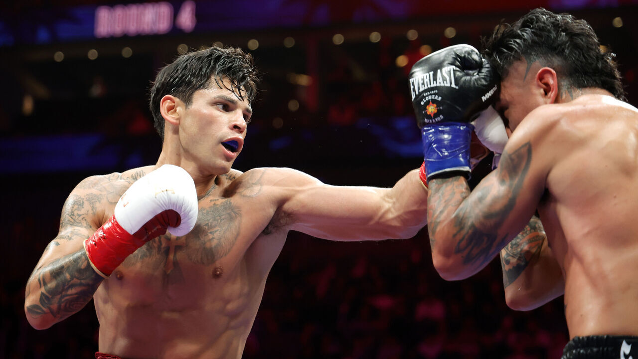 LAS VEGAS, NEVADA - FEBRUARY 21: Ryan Garcia (L) punchesWBC welterweight champion Mario Barrios in the fourth round of a title fight at T-Mobile Arena on February 21, 2026 in Las Vegas, Nevada. Garcia took the tile by unanimous decision.
