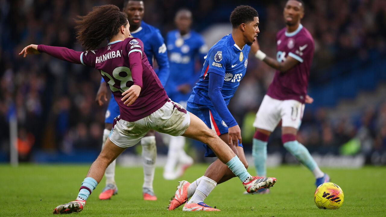LONDON, ENGLAND - FEBRUARY 21: Wesley Fofana of Chelsea is challenged by Hannibal Mejbri of Burnley during the Premier League match between Chelsea and Burnley at Stamford Bridge on February 21, 2026 in London, England.