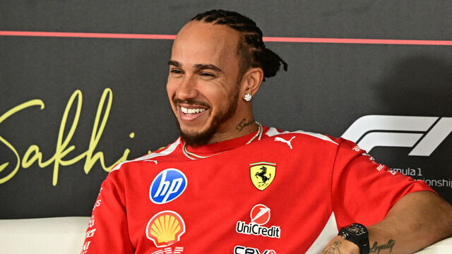 Ferrari's British driver Lewis Hamilton reacts during a press conference on the first day of the second Formula One pre-season test at the Bahrain International Circuit in Sakhir on February 18, 2026.