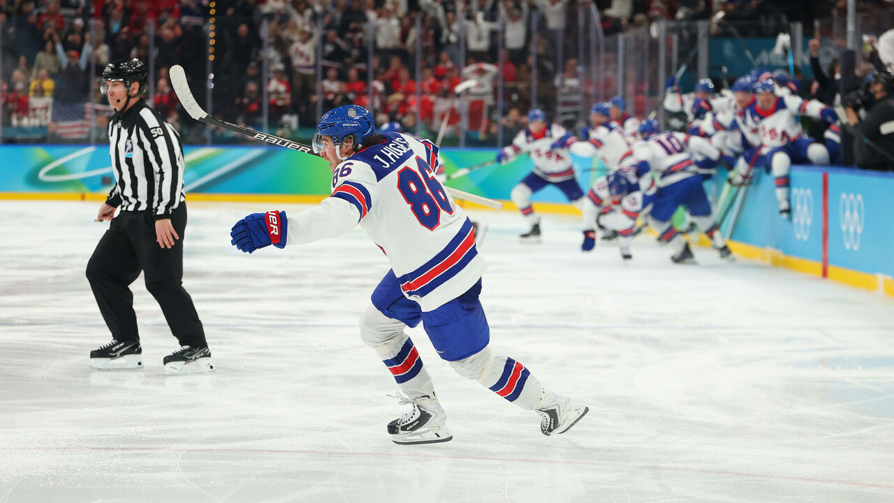 MILAN, ITALY - FEBRUARY 22: Jack Hughes #86 of Team United States celebrates scoring the game-winning goal to win the gold medals in overtime during the Men's Gold Medal match between Canada and the United States on day 16 of the Milano Cortina 2026 Winter Olympic games at Milano Santagiulia Ice Hockey Arena on February 22, 2026 in Milan, Italy.