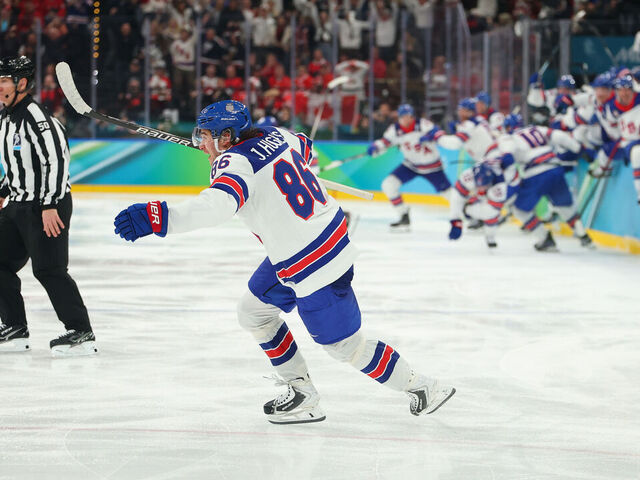 MILAN, ITALY - FEBRUARY 22: Jack Hughes #86 of Team United States celebrates scoring the game-winning goal to win the gold medals in overtime during the Men's Gold Medal match between Canada and the United States on day 16 of the Milano Cortina 2026 Winter Olympic games at Milano Santagiulia Ice Hockey Arena on February 22, 2026 in Milan, Italy.