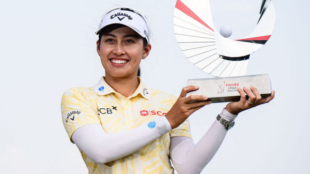 Jeeno Thitikul of Thailand poses with the trophy as she celebrates her victory during the final day of the 2026 Honda LPGA Thailand golf tournament at the Siam Country Club in Pattaya on February 22, 2026.