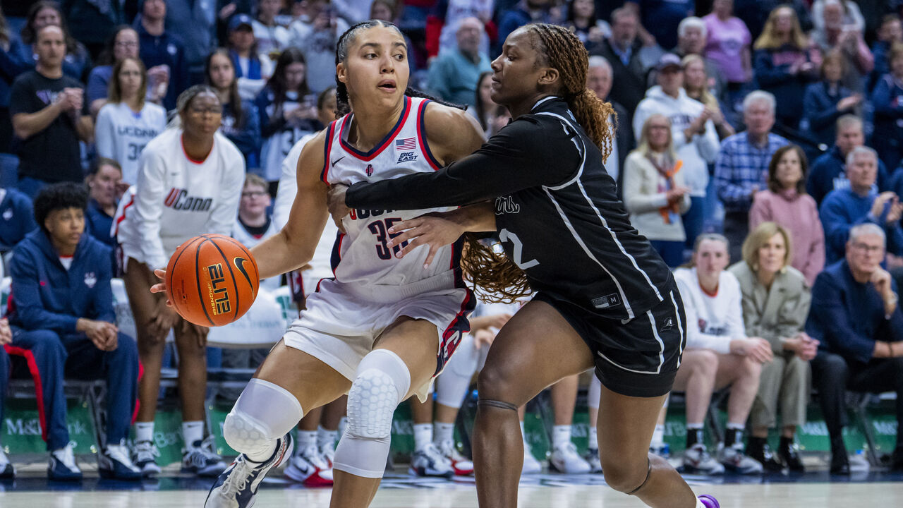 STORRS, CONNECTICUT - FEBRUARY 22: Azzi Fudd #35 of the Connecticut Huskies is defended by Princess Moody #2 of the Providence Friars during the second half of an NCAA women's basketball game at Harry A. Gampel Pavilion on February 22, 2026 in Storrs, Connecticut.