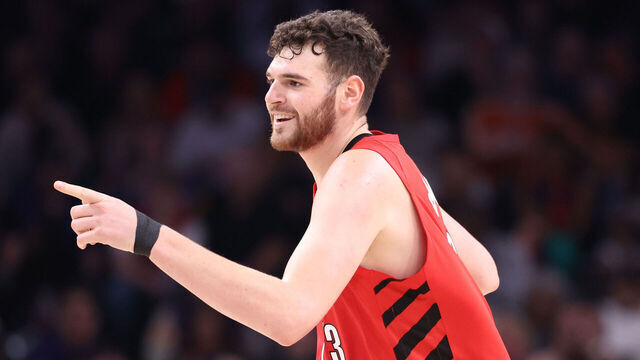 PHOENIX, ARIZONA - FEBRUARY 22: Donovan Clingan #23 of the Portland Trail Blazers gestures to the Phoenix Suns bench after hitting a three-pointer during the first half at Mortgage Matchup Center on February 22, 2026 in Phoenix, Arizona.