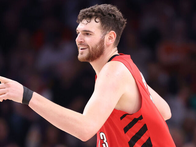 PHOENIX, ARIZONA - FEBRUARY 22: Donovan Clingan #23 of the Portland Trail Blazers gestures to the Phoenix Suns bench after hitting a three-pointer during the first half at Mortgage Matchup Center on February 22, 2026 in Phoenix, Arizona.