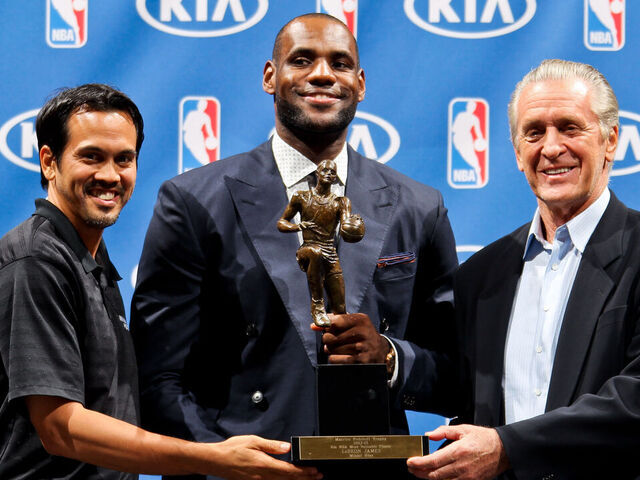MIAMI, FL - MAY 5: LeBron James #6 of the Miami Heat, center, holds the Maurice Podoloff Trophy while posing with head coach Erik Spoelstra, left, and team president Pat Riley after being named the 2012-2013 Kia NBA Most Valuable Player (MVP) of the Year on May 5, 2013 at American Airlines Arena in Miami, Florida. Mandatory Copyright Notice: Copyright 2013 NBAE