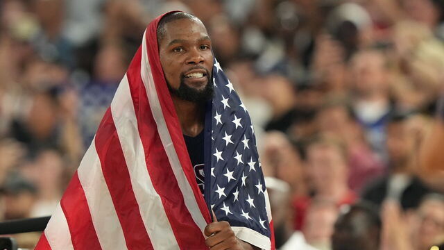 Basketball: 2024 Summer Olympics: USA Kevin Durant (7) in action, victorious with American flag following Gold Medal Game vs France at Bercy Arena. Paris, France 8/10/2024 CREDIT: Erick W. Rasco (Set Number: X164583 TK1)