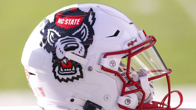 TAMPA, FL - DECEMBER 19: an NC State Wolfpack helmet rests on the sideleins during the Gasparilla Bowl between the Memphis Tigers and the NC State Wolfpack on Friday, December 19, 2025 at Raymond James Stadium in Tampa, FL