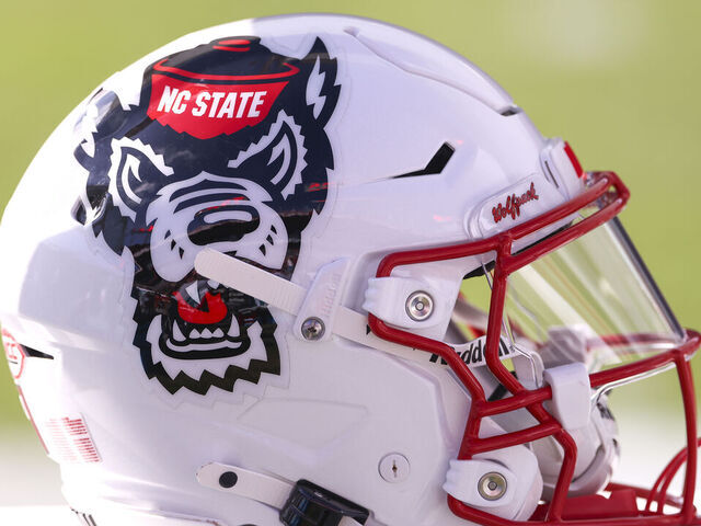 TAMPA, FL - DECEMBER 19: an NC State Wolfpack helmet rests on the sideleins during the Gasparilla Bowl between the Memphis Tigers and the NC State Wolfpack on Friday, December 19, 2025 at Raymond James Stadium in Tampa, FL