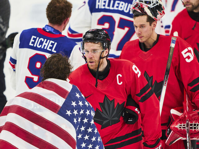 MILAN, ITALY - FEBRUARY 22: Connor McDavid of Canada handshake with Jack Hughes of Team United States after the Men`s Ice Hockey final match between USA and Canada on day sixteen of the Milano Cortina 2026 Winter Olympic games at Milano Santagiulia Ice Hockey Arena on February 22, 2026 in Milan, Italy.