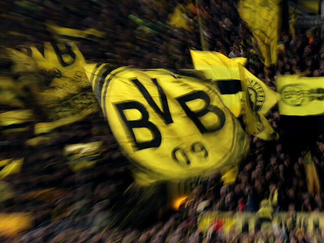 DORTMUND, GERMANY - FEBRUARY 17: Fans of Borussia Dortmund wave their flags during the UEFA Champions League 2025/26 League Knockout Play-off First Leg match between Borussia Dortmund and Atalanta BC at BVB Stadion Dortmund on February 17, 2026 in Dortmund, Germany.