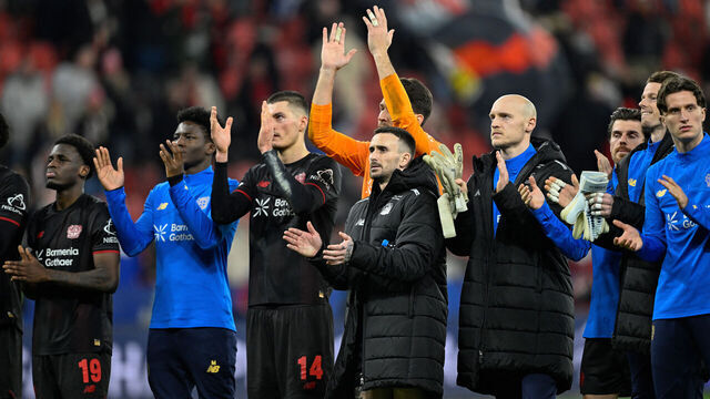 Leverkusen players applaud their fans after the UEFA Champions League play-off, second-Leg football match Bayer 04 Leverkusen vs Olympiakos in Leverkusen, western Germany, on February 24, 2026.