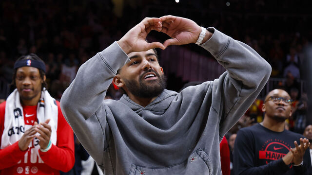ATLANTA, GEORGIA - FEBRUARY 24: Trae Young #3 of the Washington Wizards gestures to the crowd as a tribute is shown during the second quarter against the Atlanta Hawks at State Farm Arena on February 24, 2026 in Atlanta, Georgia.