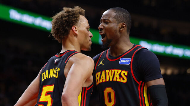 ATLANTA, GEORGIA - FEBRUARY 24: Jonathan Kuminga #0 of the Atlanta Hawks reacts with Dyson Daniels #5 during the third quarter against the Washington Wizards at State Farm Arena on February 24, 2026 in Atlanta, Georgia.