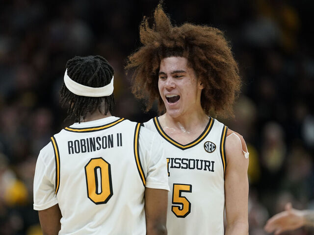 COLUMBIA, MISSOURI - FEBRUARY 24: T.O. Barrett #5 and Anthony Robinson II #0 of the Missouri Tigers celebrate after a 73-69 win over the Tennessee Volunteers at Mizzou Arena on February 24, 2026 in Columbia, Missouri.