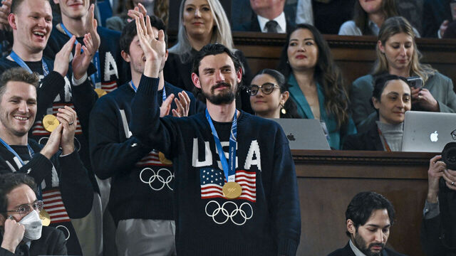 WASHINGTON, DC - FEBRUARY 24: The U.S. men's Olympic ice hockey team with Connor Hellebuyck in front attend President Donald Trump's State of the Union address to a joint session of Congress in the House Chamber at the Capitol on February 24, 2026 in Washington, DC. Behind him are Vice President JD Vance and House Speaker Mike Johnson (R-LA). Trump delivered his address days after the Supreme Court struck down the administration's tariff strategy, and amid a U.S. military buildup in the Persian Gulf threatening Iran.