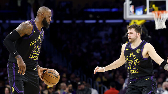 LOS ANGELES, CALIFORNIA - NOVEMBER 18: LeBron James #23 of the Los Angeles Lakers and Luka Doncic #77 in action against the Utah Jazz during the first half at Crypto.com Arena on November 18, 2025 in Los Angeles, California.